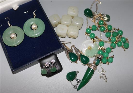 A small group of jade and other hardstone jewellery including a pair of earrings and a pendant.
